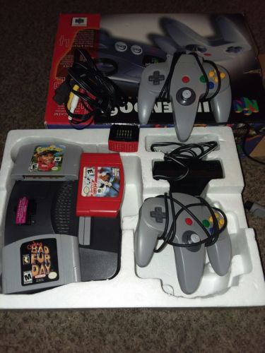 Nintendo 64 Console In Box with 2, oringal Controllers, and 3 games..