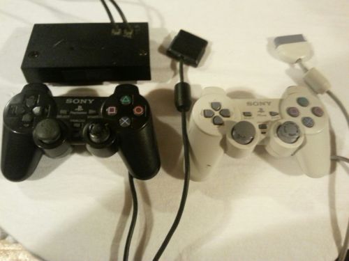 Playstation controllers and network adapter sold as lot not tested.