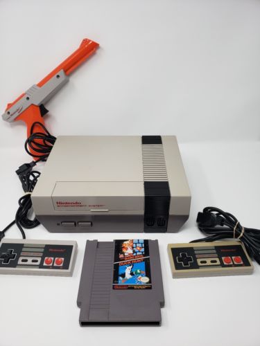 Nintendo NES with 2 controllers, duck hunt & zapper **FOR PARTS OR REPAIR**