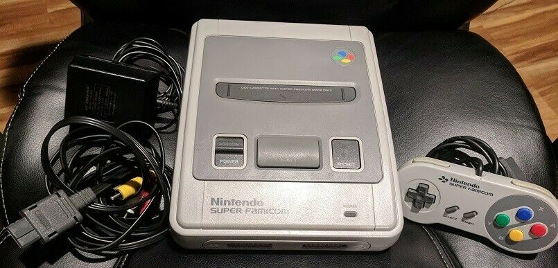 Nintendo Super Famicom with 1 controller, AC Adapter, AV cable, and 4 games