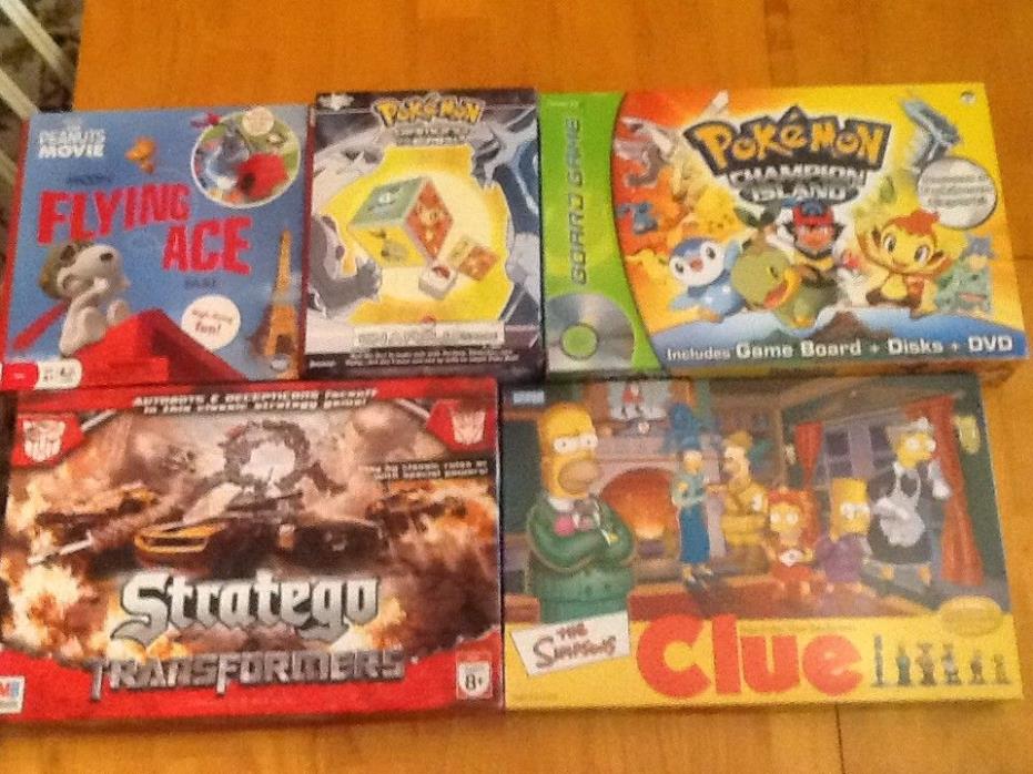 Collection/Lot of 5 Awesome Games, Transformers, Pokemon, Simpsons & Peanuts