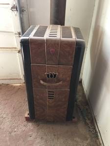 Antique wood burning heater