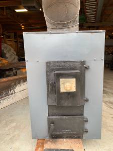 Wood burning forced air stove