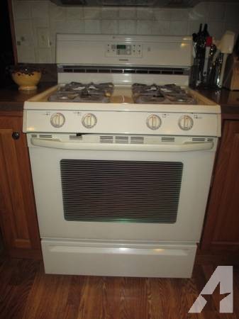 Maytag gas oven and stovetop and GE microwave -