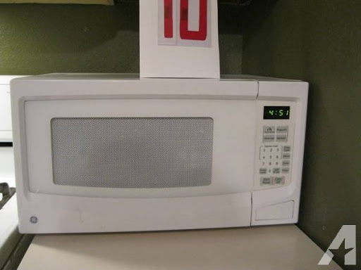 GE microwave white 1100 watts works excellent -