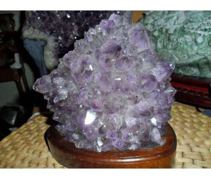 Exceptionally a Huge Amethyst Gemstone Light on a Wooden Base