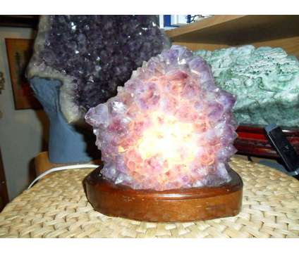 Exceptionally a Huge Amethyst Gemstone Light on a Wooden Base