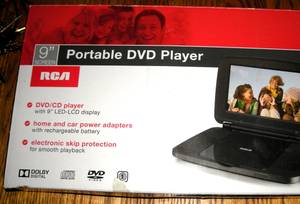 2 Portable DVD players, Dozens of DVD Movies