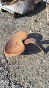 Old steel implement seat (West Bend , WI)