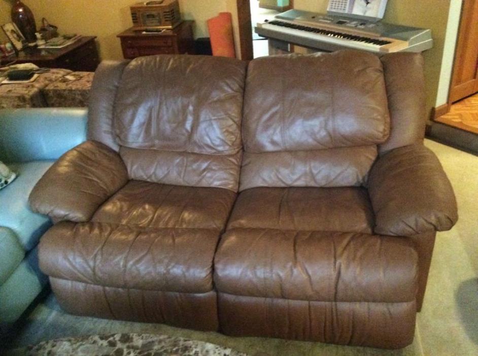 Leather reclining loveseat and matching sw8vel recliner for sale