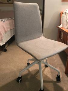 Grey desk chair, chair cushions.