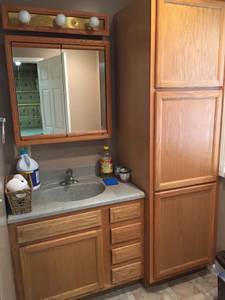 Bathroom vanity, cabinets, and mirror