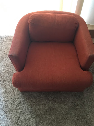 Orange couch chair. 1-seater. Used. No pegs to stand on.