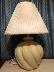 Cream colored ceramic table lamp with a soft nylon shade