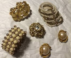 3 bracelets a pin and earrings. (Midland)