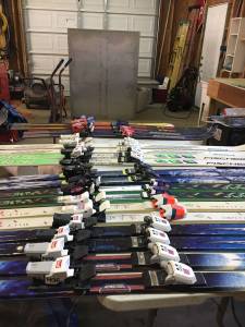 12 pairs of used skis