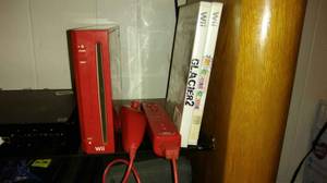 Red Wii with Wireless Sensor Bar and 2 games