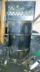 Free used motor oil in a metal drum (PA)